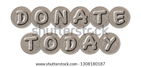 DONATE TODAY written with old coins on white background