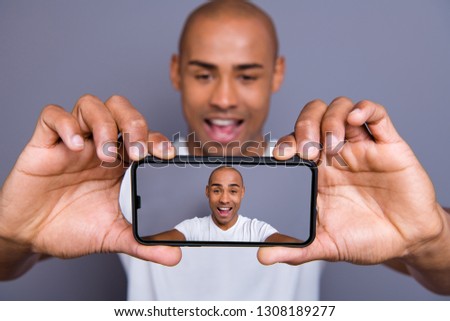 Close up photo attractive dark skin he him his macho short hairdo make take selfies great pictures size quality yeah yes facial expression wearing white t-shirt outfit clothes isolated grey background
