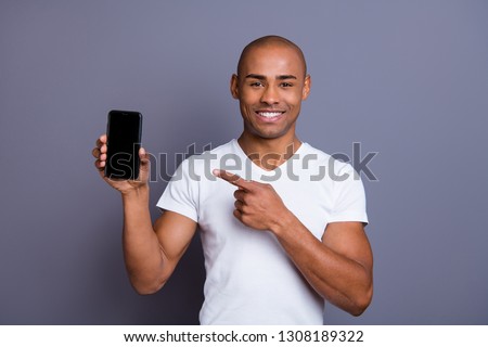 Close up photo strong healthy dark skin he him his macho bald head finger show new telephone version advising buy buyer promotional wearing white t-shirt outfit clothes isolated grey background