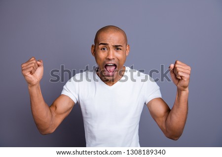 Close up photo strong healthy dark skin he him his macho bald head mouth opened in delight yell in big great winning unexpected wearing white t-shirt outfit clothes isolated grey background