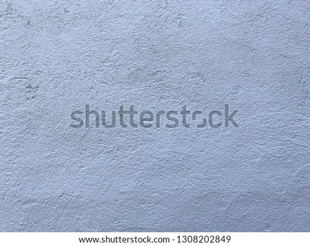 White stipple effect wall in grey color texture background
