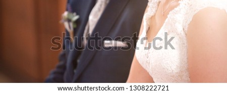 Panorama of a bride and a groom in church, wedding banner