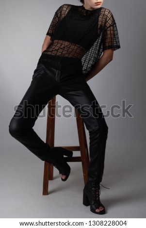 Stylish photo with a smart model in fashionable clothes in the studio