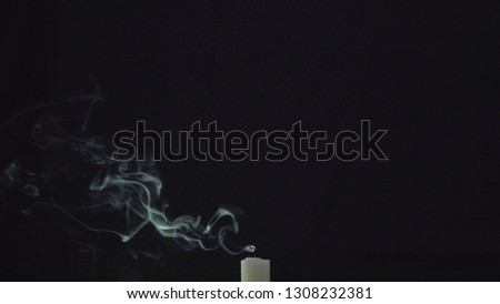 The smoke from the candles. Black background. The winding pattern. Isolated. Mystery and mystique. Feelings and emotions.