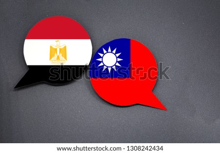 Egypt and Taiwan flags with two speech bubbles on dark gray background