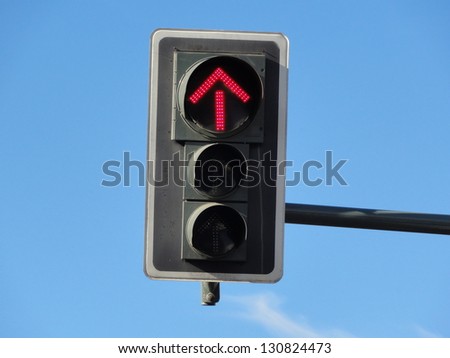 Photo of a traffic sign with a red arrow displayed