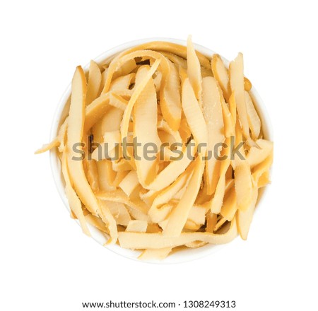 Dried shredded squids in a round plate solated on white background