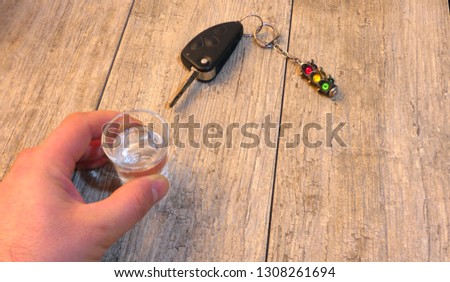 binge and keys from the car. You can not drink at the wheel.Alcoholic drink and car keys - do not drink and drive concept