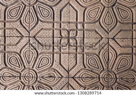 Old vintage tile background with geometric lines and floral design. Horizontal color photography.