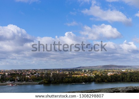 Aerial view of the Danube Band and hungarian city esztergom, slovakian city sturovo and danube river including spires of the saint ignac church
