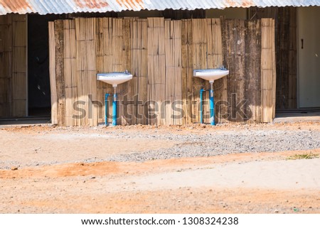 Front view of men's washroom in campsite.Thailand