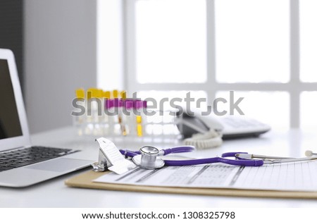 Computer keyboard, mouse and notebook with a pencil on the table