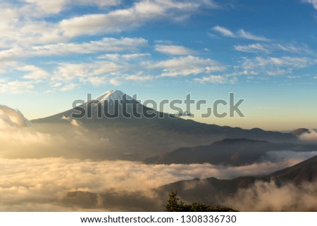 Fuji mountain and the mist over Lake Kawaguchiko at beautiful sunrise , Yamanashi, Japan, Mount Fuji or Fujisan located on Honshu Island, is the highest mountain in Japan