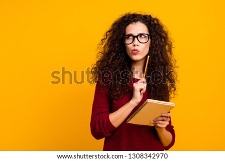 Portrait of her she nice cute attractive unsure wavy-haired lady thinking about article news question academic isolated over bright vivid shine background Royalty-Free Stock Photo #1308342970