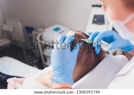 Platelet rich plasma injection procedure. Hair growth stimulation. PRP therapy process. Royalty-Free Stock Photo #1308395749