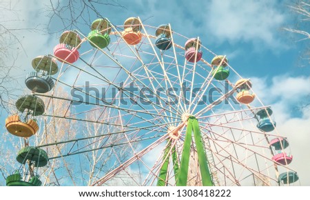 Multicolored Ferris wheel in the Park. High key picture