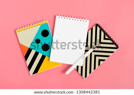set of notebooks for notes and pens on pink background Place for text Flat lay Top view Goals,Means, Resolution concept Mock up