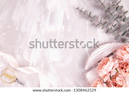 Styled stock photo background for Social Media, Branding and Blog. Flat lay image with gray cement background, eucalyptus and flowers         