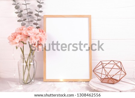 Wood frame with white paper mockup. Styled stock photo for Social Media, Branding and Blog. Flat lay image with white wood and flowers