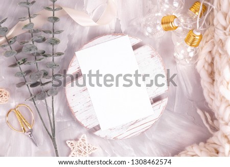 Invitation, greeting card with white paper mockup. Styled stock photo for Social Media, Branding and Blog. Flat lay image with white wood and flowers