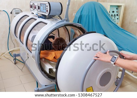 Hyperbaric oxygen chamber in a hospital. Royalty-Free Stock Photo #1308467527
