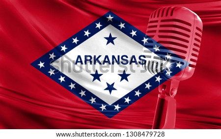 Microphone on fabric background of flag State of Arkansas close-up