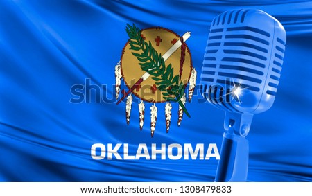 Microphone on fabric background of flag State of Oklahoma close-up