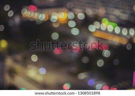 The lights of the night city. Blurred background. Abstract unfocused picture. Lanterns on the street.