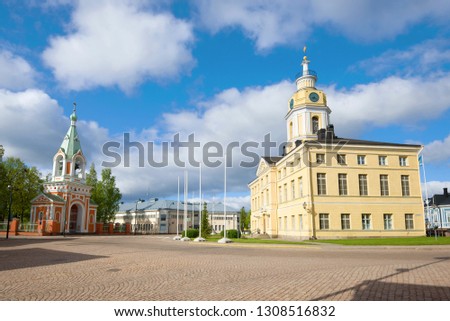 Old Town Hall and the bell tower of the Church of the Apostles Peter and Paul on a June day. Hamina, Finland Royalty-Free Stock Photo #1308516832