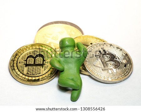 Leisure at the expense of investment, the plasticine man resting on a pile of bitcoins