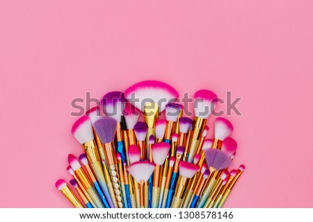 Cosmetic Makeup Brush Set. Professional Make up Brushes on pink  background, close up