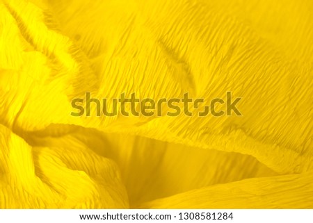Yellow, crumpled paper.  Background of crumpled paper. Close up.