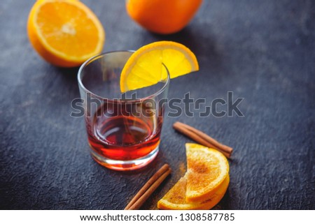 Rum and orange slices sprinkled with cinnamon as a snack.