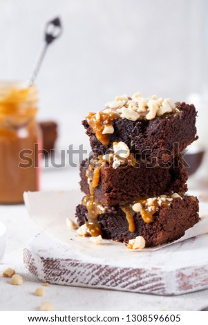 chocolate dessert brownie salted caramel peanuts baking Royalty-Free Stock Photo #1308596605