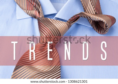 TRENDS  word written on shirt and tie