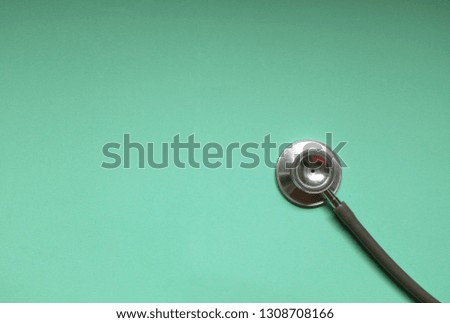  copy space Stethoscope on green background. space for text