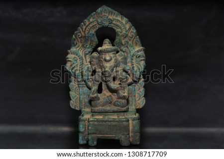 Elephant headed god monk on black background