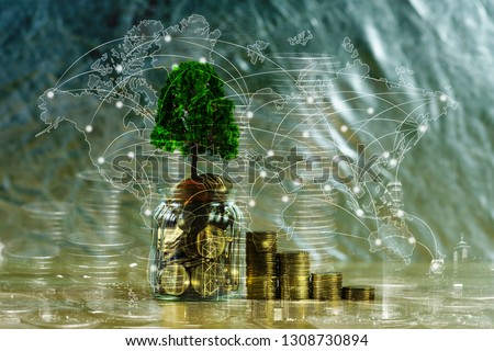Tree growing on pile of golden coins, growth business finance investment and Corporate Social Responsibility or CSR practice and sustainable development concept idea. Royalty-Free Stock Photo #1308730894