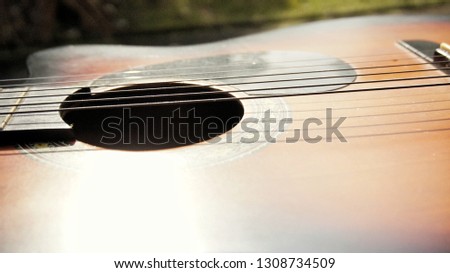 Close up image of part of an acoustic guitar