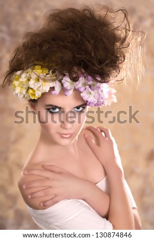 pretty young woman with beautiful hairstyle on a colored background