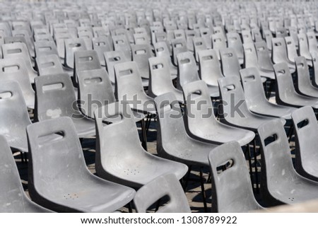 Lots of chairs prepaed for an open air event