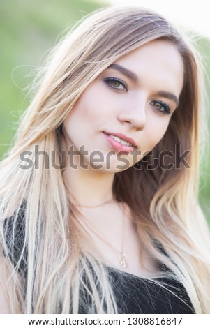 Portrait of a young cute woman