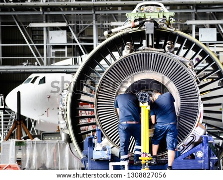 Jet engine remove from aircraft (airplane) for maintenance at aircraft hangar.Jet engine maintenance and change part by aircraft technician . Royalty-Free Stock Photo #1308827056