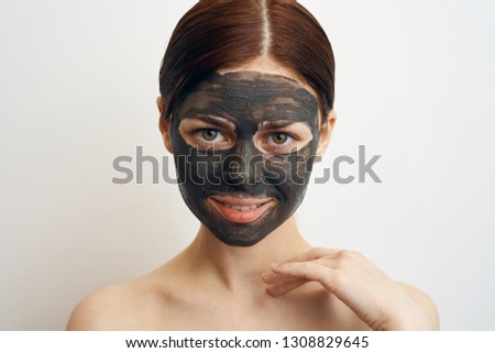 woman in clay mask