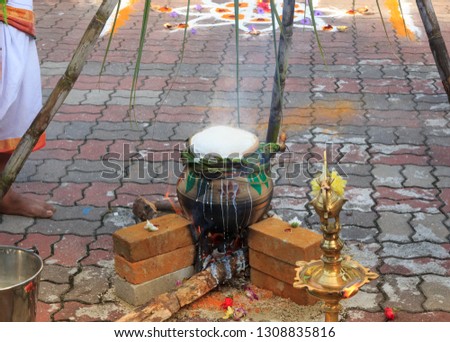 Cooking rice on Ponggal festival in front of a Hindu temple, Kuala Lumpur
