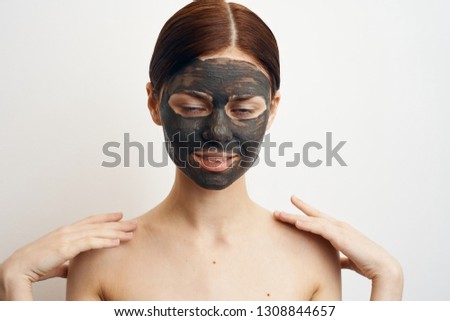 woman in clay mask care