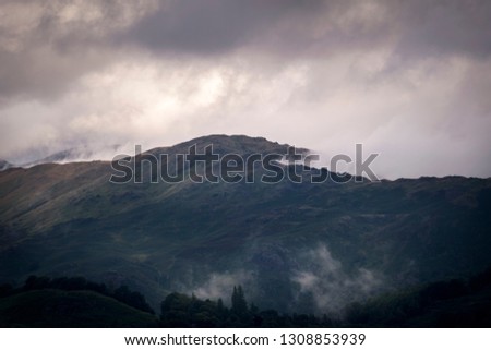 Clouds covering the hills of England in the morning giving mystic scene
