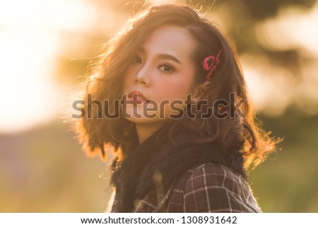 Asian woman beautiful  in the winter, evening time, soft focus