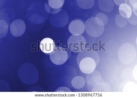 White bokeh on a blue background