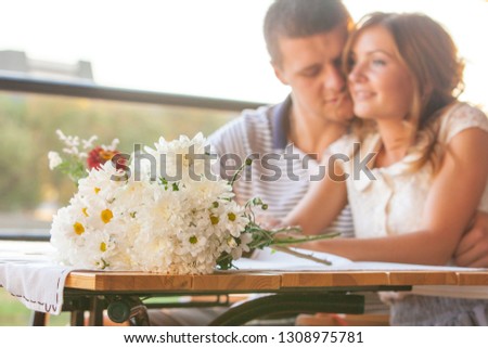 young couple in an open air cafe
